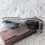 MOSCOT Transparent Rectangular Sunglasses with Dark Lenses